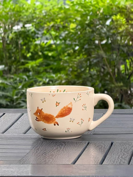 Dashing Fox 26 oz large ceramic mug in soft cream with a running fox design