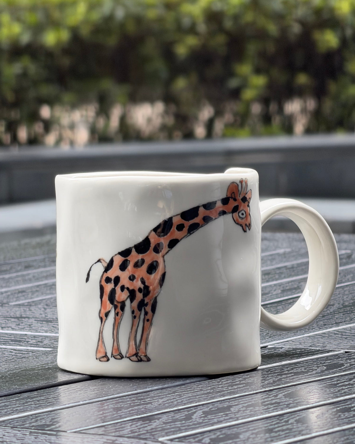 Full giraffe illustration on hand-painted ceramic mug, orange and black spotted giraffe on ivory stoneware, The Quiet Clay