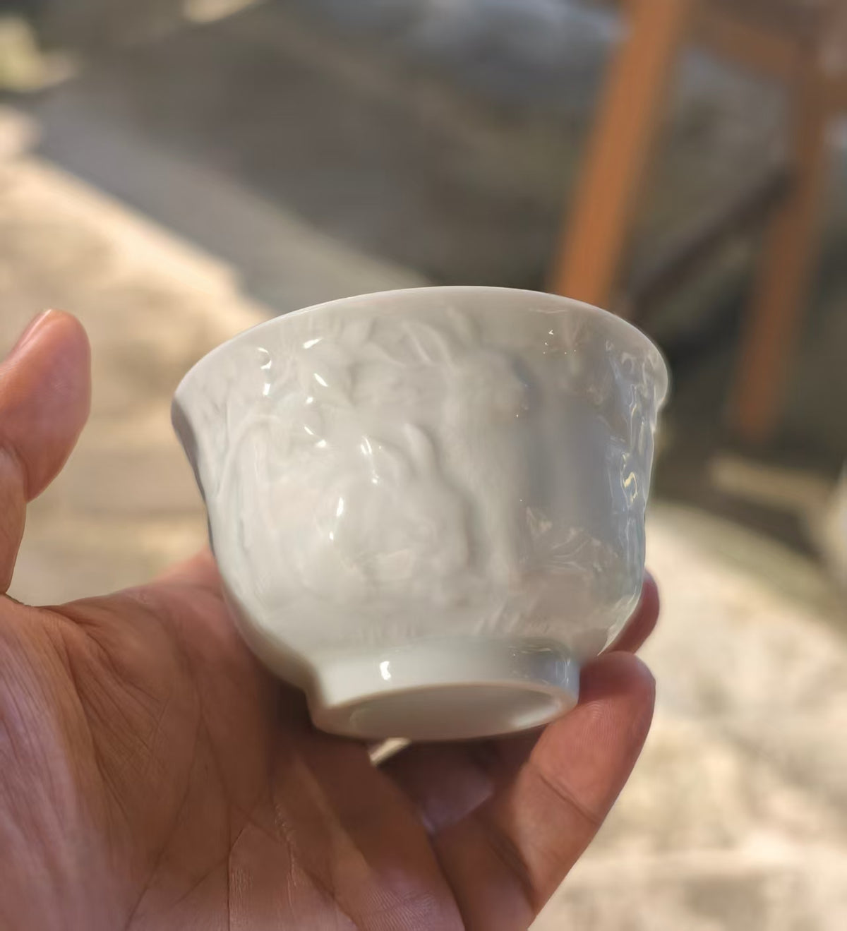 Hand-carved Rabbit Chinese Zodiac white porcelain tea cup by Yan Wenlu with subtle relief carving