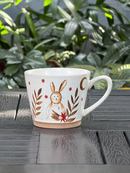 Moonlit Rabbit ceramic mug with whimsical rabbit, stars and botanical illustration