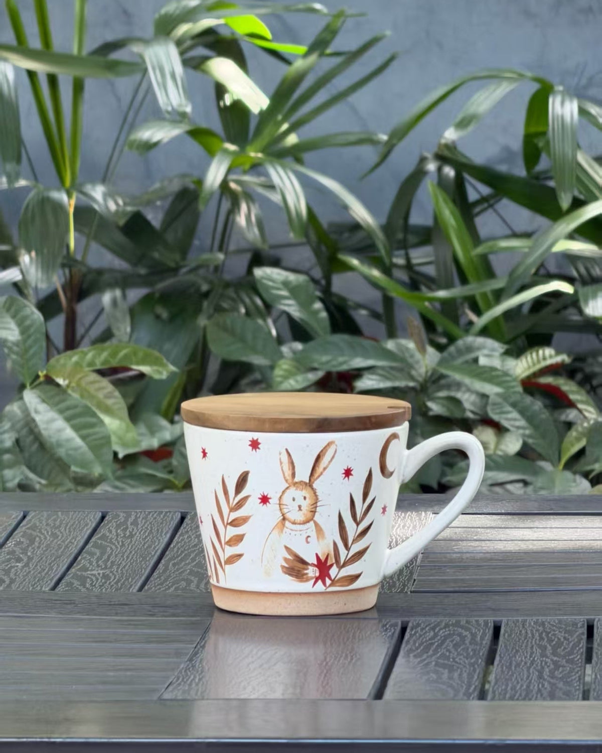 Moonlit Rabbit ceramic mug with a wooden lid, whimsical rabbit, crescent moon, stars and botanical design