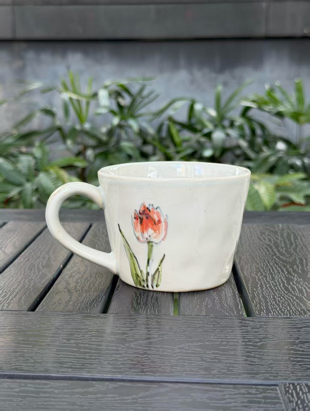 Back view of Orange Tulip hand-painted mug showing free-flowing tulips and leaves