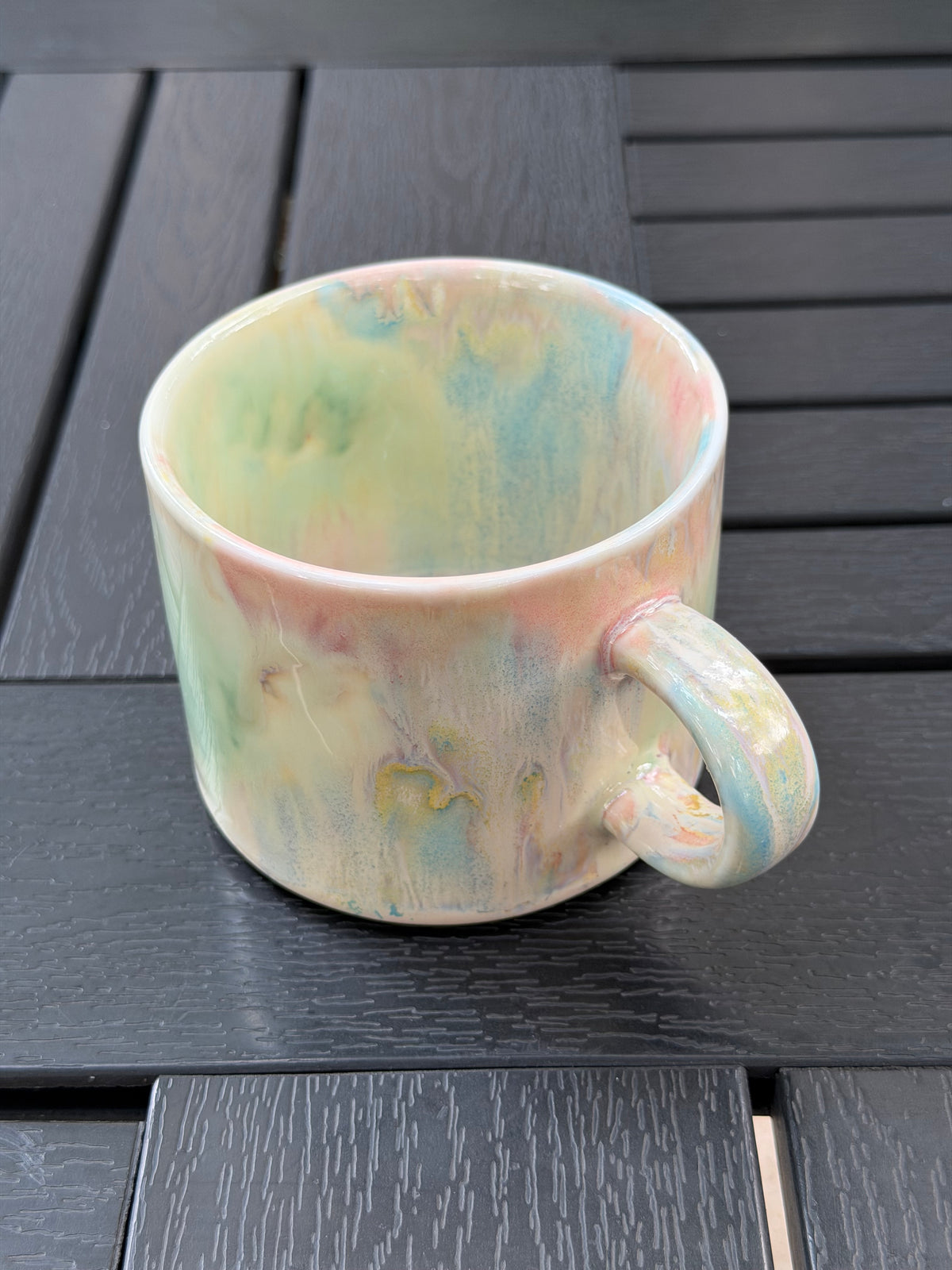 View into the Pastel Meadow mug showing softly blended glaze colors across the interior and rim