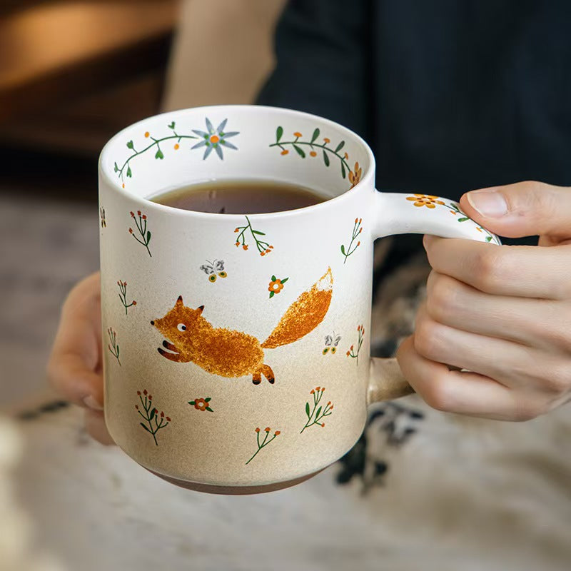 Large 550 ml Running Fox ceramic mug held in hand with tea
