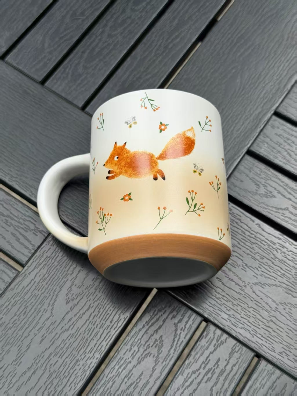 Running Fox ceramic mug showing its warm brown base and matte gradient finish