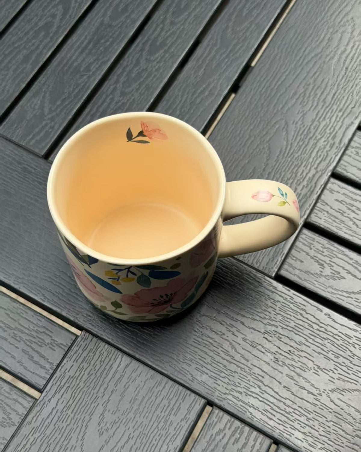 Top view of Soft Bloom ceramic mug showing the cream interior and small flower detail inside the rim