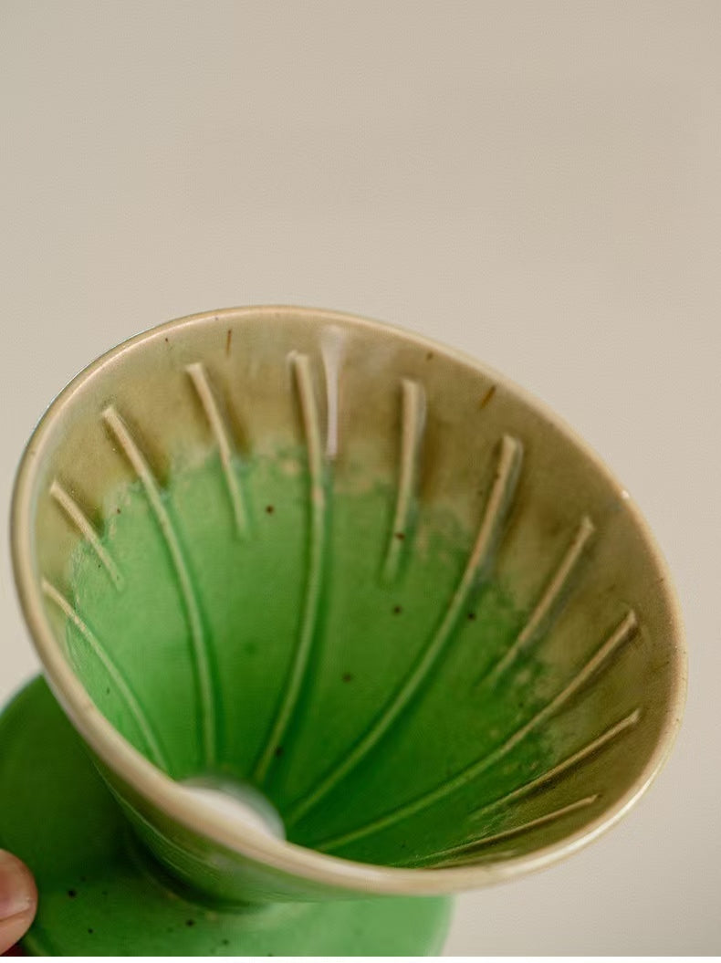 Interior view of green ceramic coffee dripper showing spiral ridges