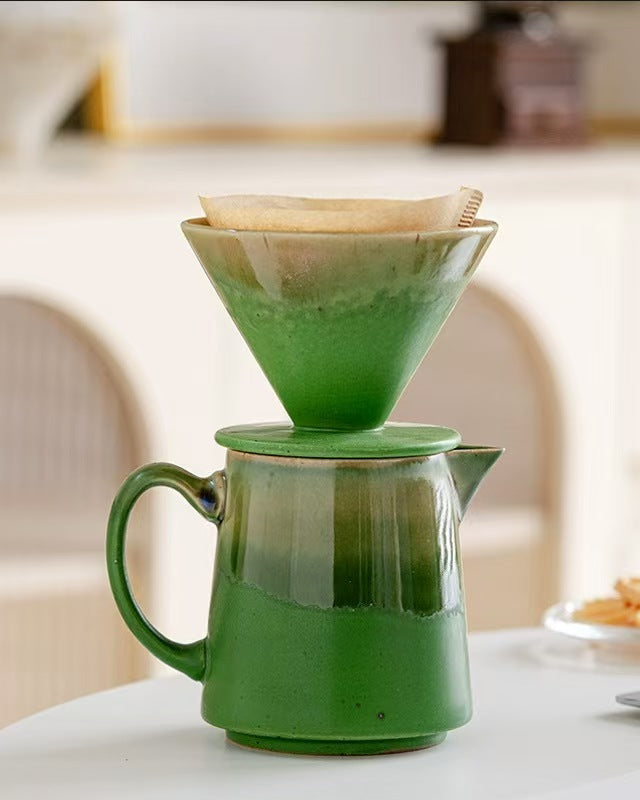 Green ceramic pour-over dripper with paper filter ready for brewing