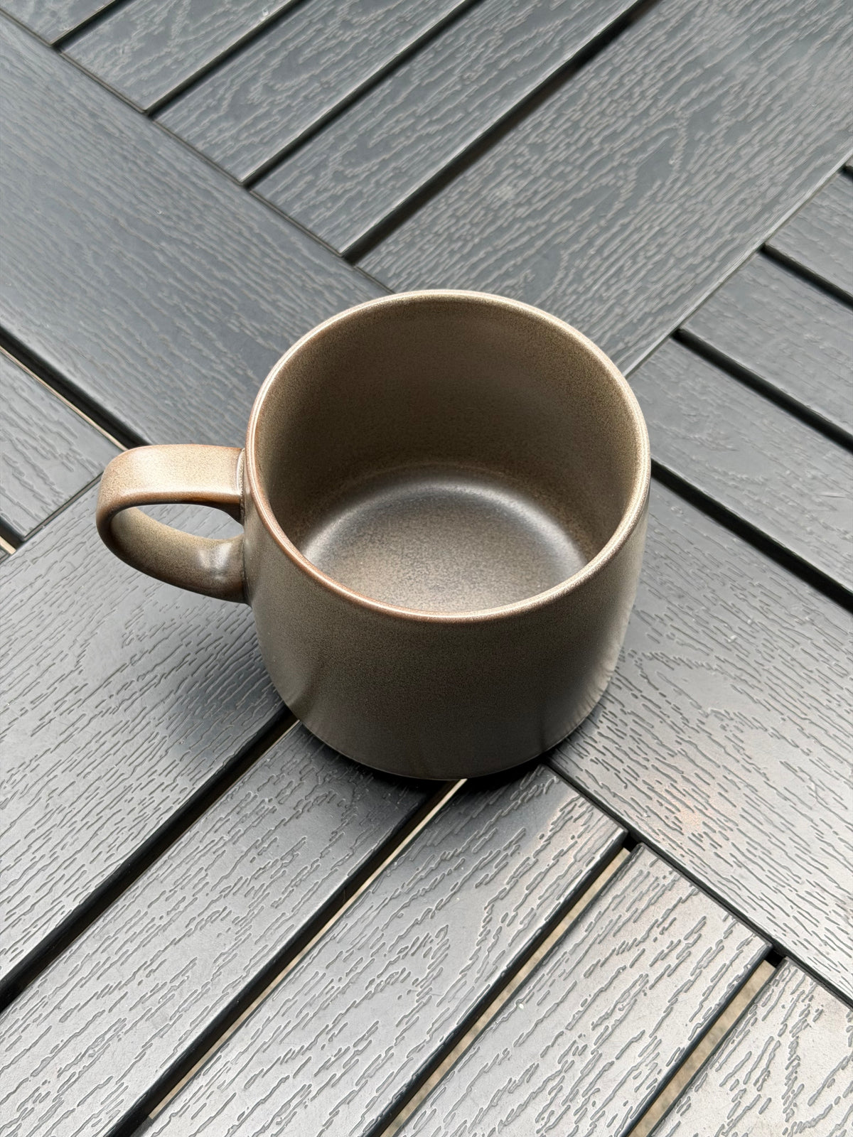 Top view of the Warm Stone ceramic mug showing its textured grey interior, wide opening and rounded handle
