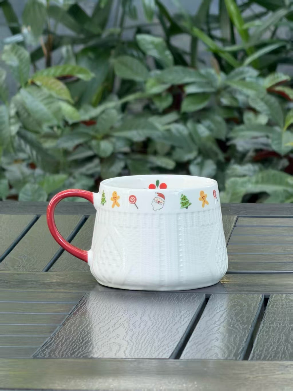 Back view of Winter Knit holiday ceramic mug with raised sweater texture and red handle