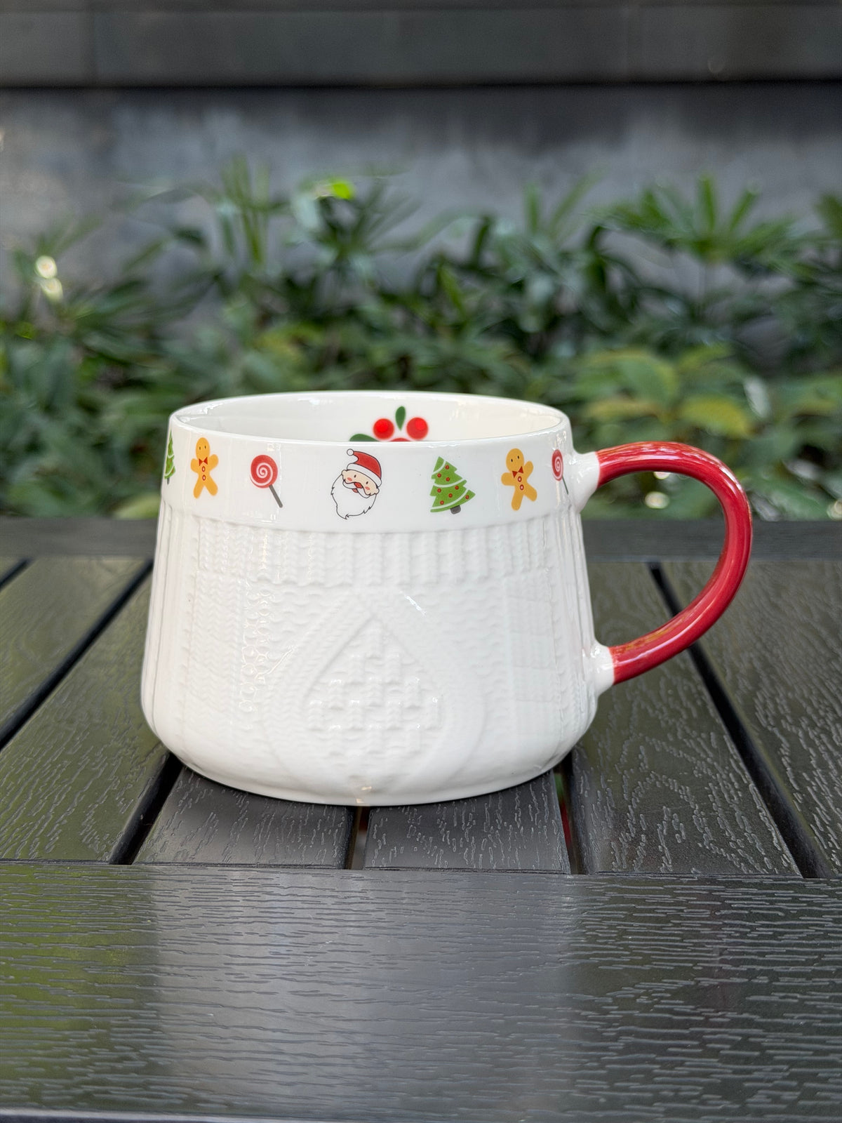Winter Knit holiday ceramic mug with white raised sweater texture and red handle
