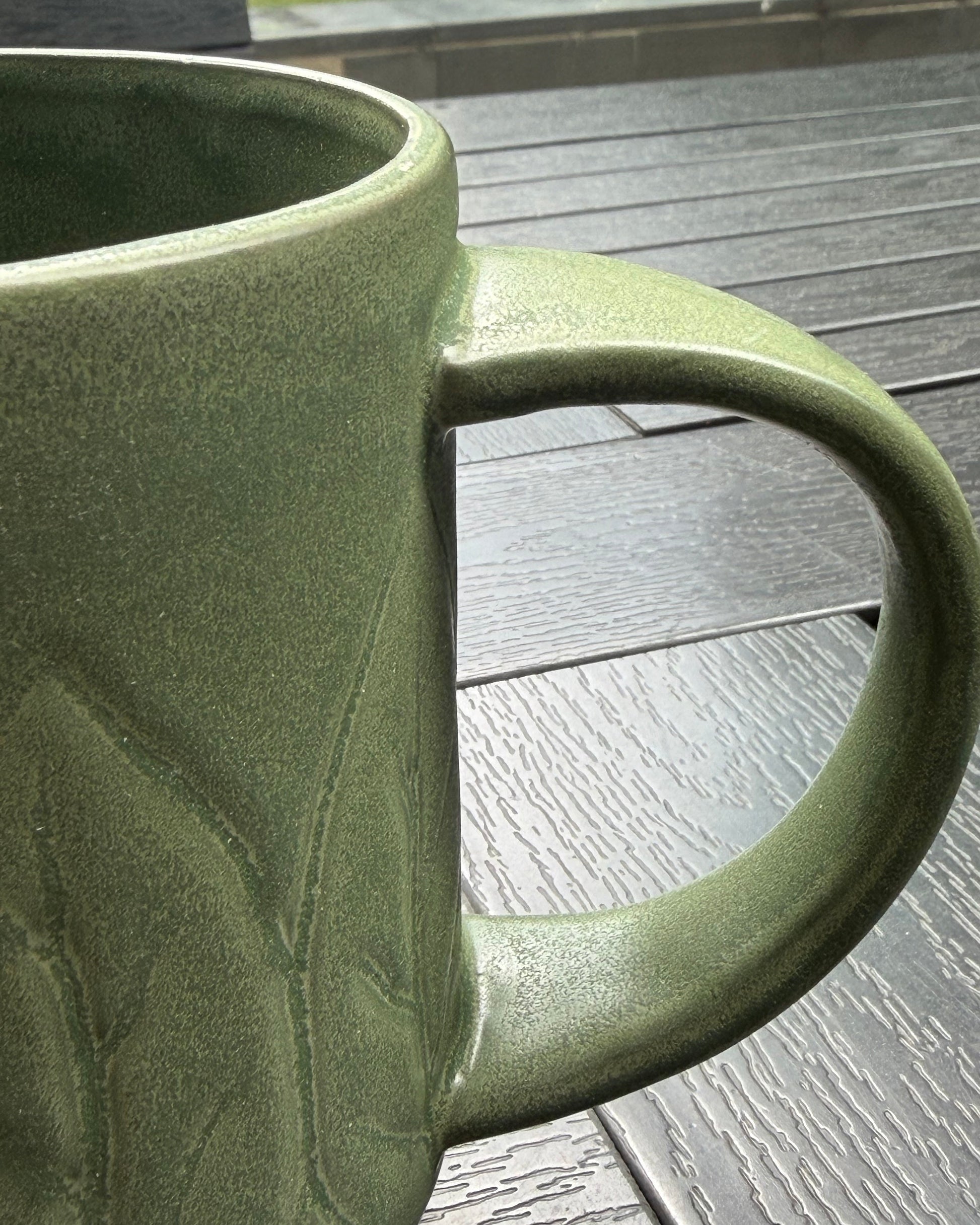 Woodland Sprig Stoneware Mug – close-up detail of botanical relief texture and glaze variation